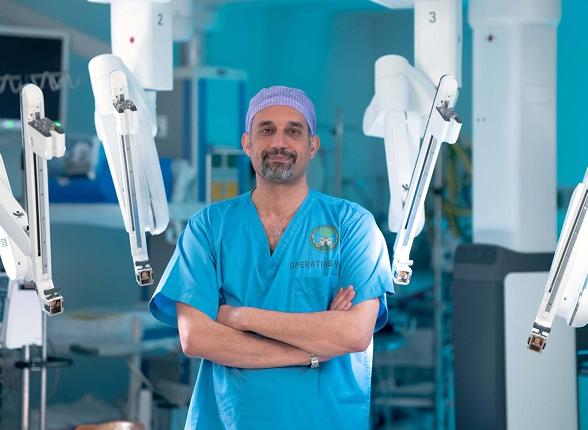 A team of surgeons performing an operation under surgical lights