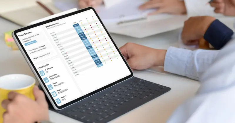 A team of surgeons performing an operation under surgical lights